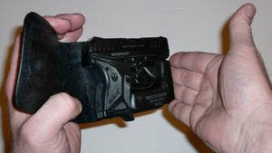 Wallet style top covered back pocket holster for licensed concealed weapon carry of Ruger LCPII