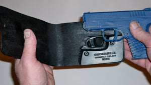 Wallet style top covered back pocket holster for licensed concealed weapon carry of Springfield XDS