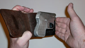 Wallet style top covered back pocket holster for licensed concealed weapon carry of Double Tap