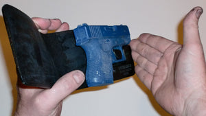 Wallet style top covered back pocket holster for licensed concealed weapon carry of Glock 26 27 33