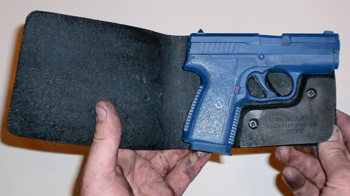 Wallet style top covered back pocket holster for licensed concealed weapon carry of Kahr PM45