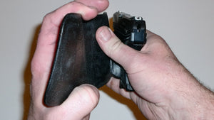 Wallet style top covered back pocket holster for licensed concealed weapon carry of Ruger LCPII