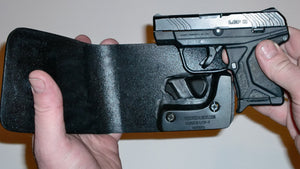 Wallet style top covered back pocket holster for licensed concealed weapon carry of Ruger LCPII