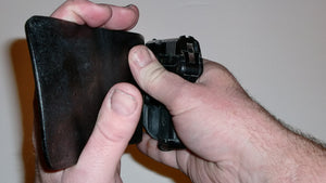 Wallet style top covered back pocket holster for licensed concealed weapon carry of Ruger LCP