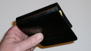 Wallet style top covered back pocket holster for licensed concealed weapon carry of Springfield 911