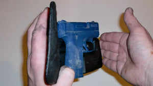 Wallet style top covered back pocket holster for licensed concealed weapon carry of S&W M&P Shield