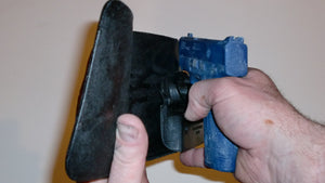 Wallet style top covered back pocket holster for licensed concealed weapon carry of S&W M&P Shield