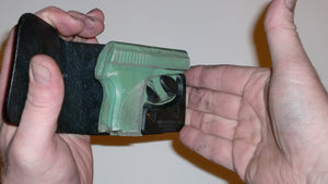 Wallet style top covered back pocket holster for licensed concealed weapon carry of Seecamp 32 380