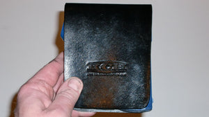 Wallet style top covered back pocket holster for licensed concealed weapon carry of Taser Pulse