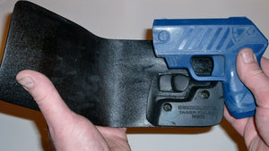 Wallet style top covered back pocket holster for licensed concealed weapon carry of Taser Pulse