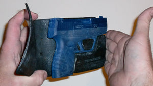 Wallet style top covered back pocket holster for licensed concealed weapon carry of Taurus 709