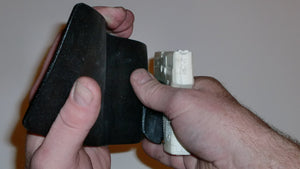 Wallet style top covered back pocket holster for licensed concealed weapon carry of Taurus TCP