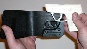 Wallet style top covered back pocket holster for licensed concealed weapon carry of Taurus TCP